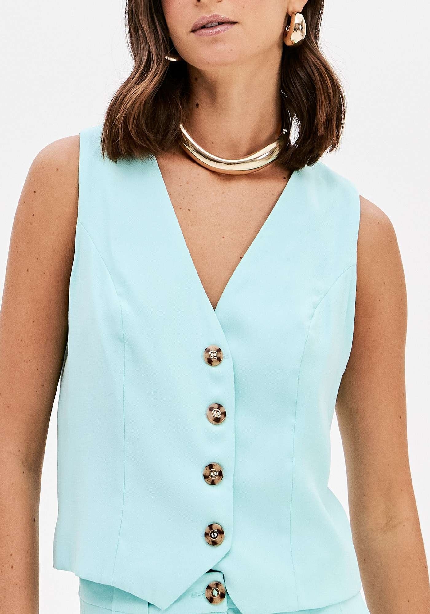 COLETE COM BOTÕES E DECOTE V LANÇA PERFUME